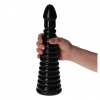 Fokozatosan bővülő anális szexuális segédeszköz fekete színben és tapadókoronggal, a kéz nélküli használatra.