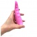 Kicsi, rózsaszín szexuális segédeszköz vibrotojással ellátva, kézben tartva.